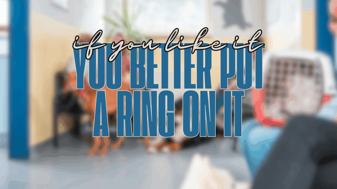 A funny mom blog marriage moment: a frazzled mom sits in a vet’s waiting room with her wild dog pulling on the leash, kids snacking in the background, while a stranger mistakes her for single because her wedding ring is missing.