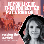 A funny mom blog marriage moment: a frazzled mom sits in a vet’s waiting room with her wild dog pulling on the leash, kids snacking in the background, while a stranger mistakes her for single because her wedding ring is missing.