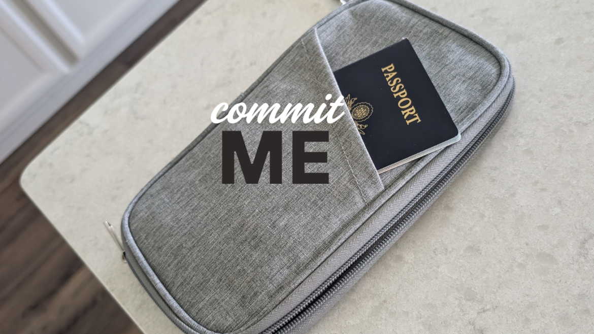 A blue US passport peeking out of a gray travel wallet on a kitchen counter - travel anxiety and guardian angel story on Raising the Curtins